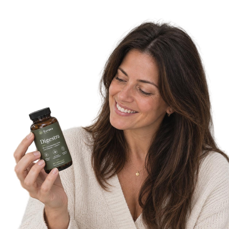 Smiling customer holding Eureka Digestra bottle